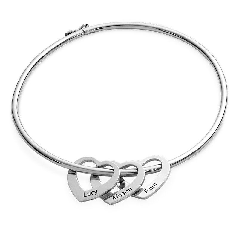 Bangle bracelet with heart pendants